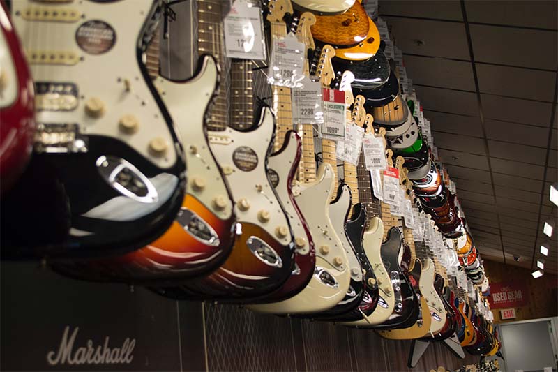 Row of electric guitars hanging at a music store
